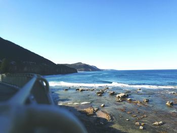 Scenic view of beach against clear sky