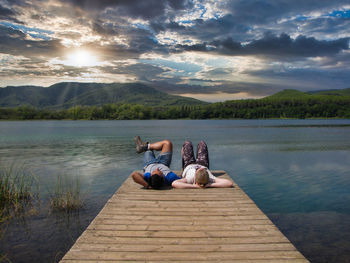 Scenic view of lake against sky during sunset