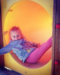Portrait of cute girl playing in playground