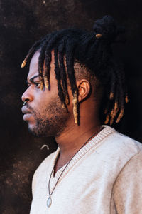 Portrait of young man looking away