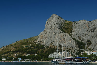 Panoramic view of mountain range against blue sky