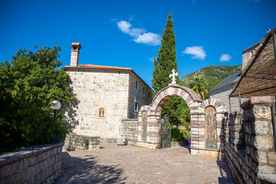 Exterior of historic building against blue sky