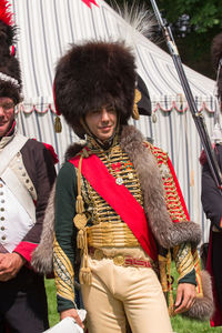 Man and woman standing in traditional clothing