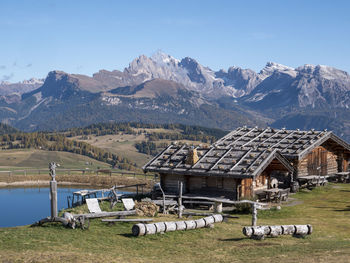 Houses and mountains against sky