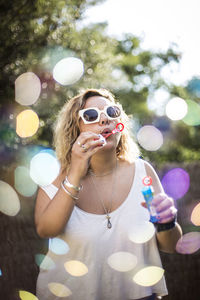 Portrait of young woman with bubbles