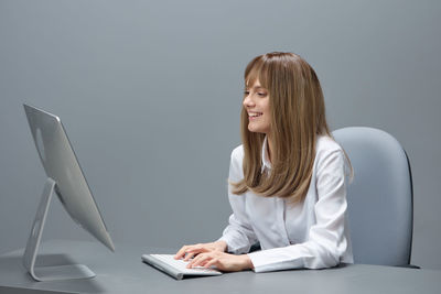 Young woman using laptop at home