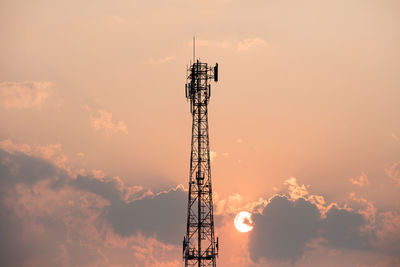 Low angle view of communications tower against sky