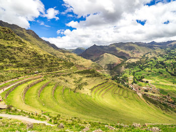 Scenic view of landscape and mountains against sky