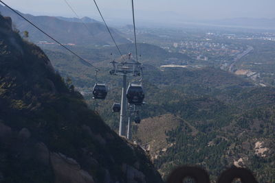 High angle view of overhead cable car over mountains