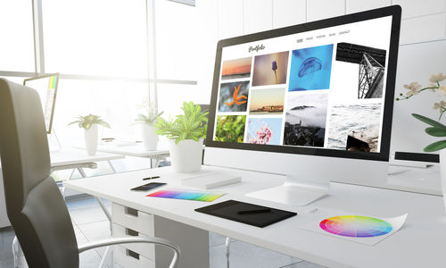 Computer and office supplies on desk