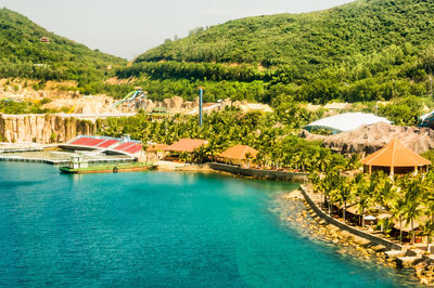 Scenic view of swimming pool by sea against sky