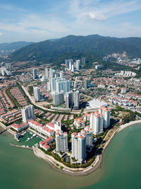 High angle view of buildings in city against sky