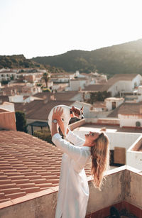 Rear view of woman standing in city