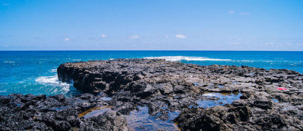 Scenic view of sea against clear blue sky