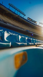 Close-up of car against blue sky