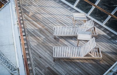 High angle view of deck chairs in boat