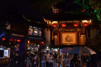 Group of people in market at night