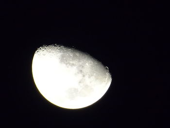 Low angle view of moon against sky at night