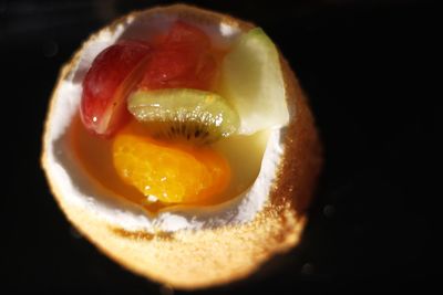 Close-up of lemon slice in black background