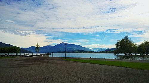 Scenic view of mountains against cloudy sky