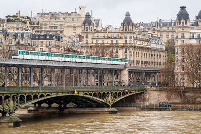 Old metro line 6 on the passy viaduct of the bir hakeim bridge in paris - france