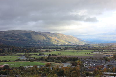 Scenic view of landscape and mountains against sky