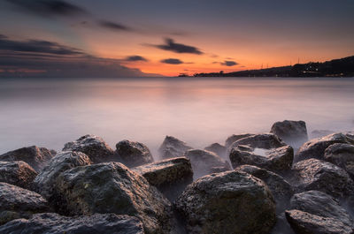 Scenic view of sea against sky during sunset