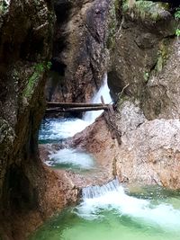 High angle view of waterfall in forest