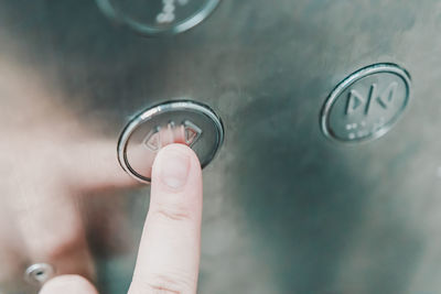 Close-up of hand holding metal