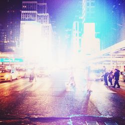 People on city street at night