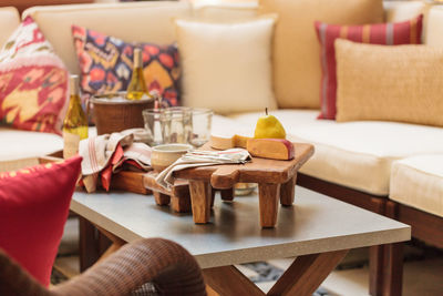 High angle view of cheese and pear on table at patio