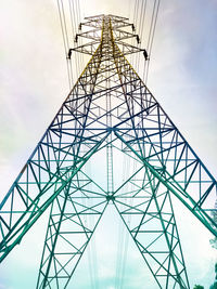 Low angle view of electricity pylon against sky