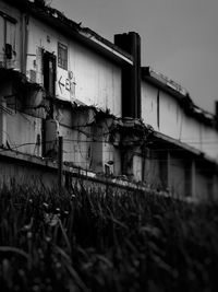 Low angle view of abandoned building against clear sky