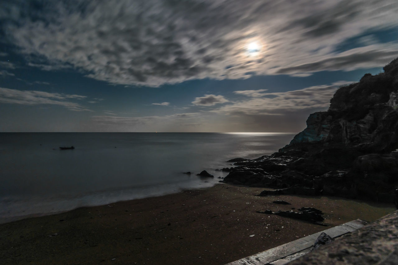 sea, horizon over water, water, beach, sky, scenics, tranquil scene, shore, tranquility, beauty in nature, cloud - sky, nature, sunset, idyllic, rock - object, coastline, cloud, cloudy, sand, wave