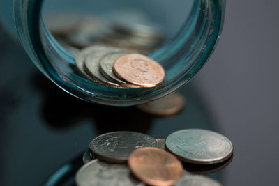 Close-up of coins on table