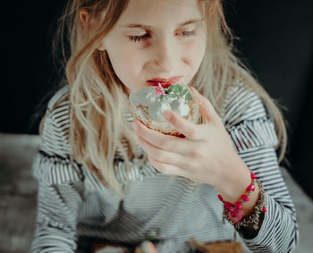 Midsection of woman holding ice cream