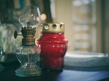 Close-up of oil lamp on table