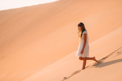 Woman standing in desert