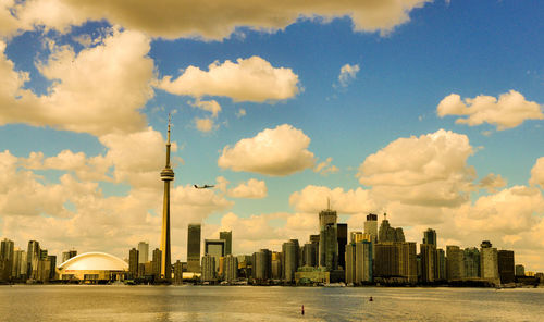 View of buildings against cloudy sky