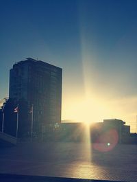 View of cityscape against sky at sunset