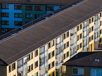 A modern building with windows in a vibrant urban residential district