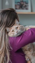 Portrait of cat looking away at home