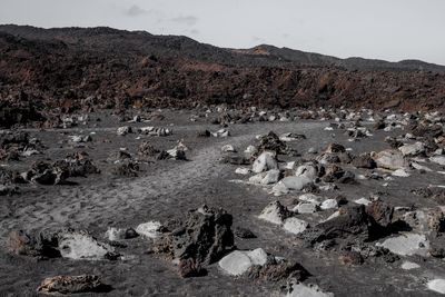 Rocks on shore against sky