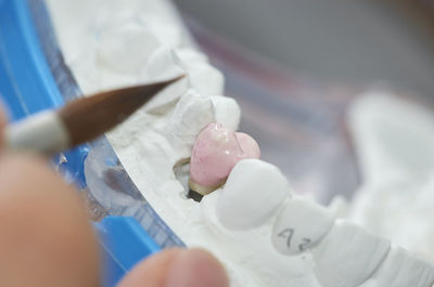 Close-up of hand holding ice cream