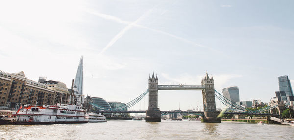 Low angle view of tower bridge over thames river against sky