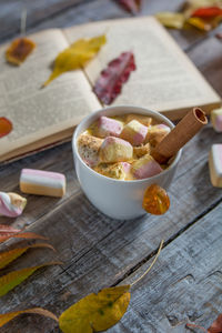 High angle view of coffee cup with marshmallow