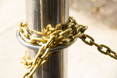 Close-up of rope tied to metal pole