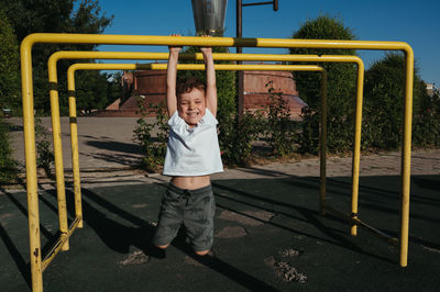 Rear view of man standing in playground