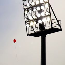 Low angle view of street light against sky