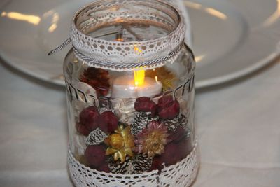 High angle view of fruit in glass jar on table